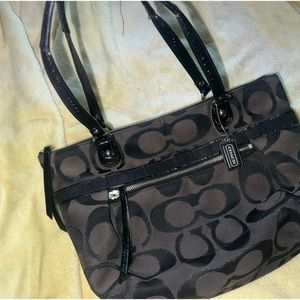 Dark black and brown Coach bag with Tiffany blue interior